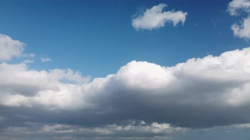 Clouds in Fast Movement in the Blue Sky in Spring in France