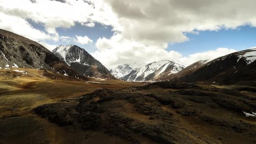 Mountain Landscape with Snowy Peaks in the Springtime
