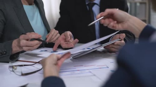 Financial workers discussing future development plans in office, team connection