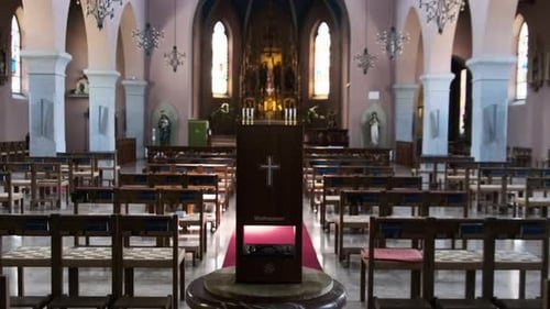 Empty Catholic Cathedral Inside Wooden Benches for Prayers Church Interior