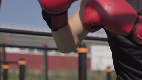 Man Working Out Punching a Punching Bag