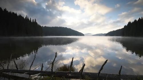 Blue morning at mountain lake beach