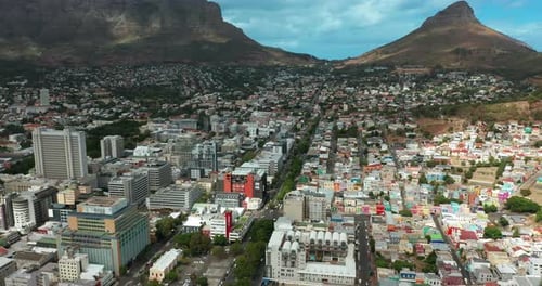 Wide Aerial Shot Tracking Forward Into the City of Cape Town During a Spectacular Sunset with Table
