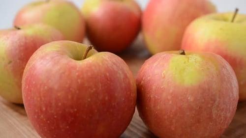 Close Up of Fresh Apples on Wooden Surface