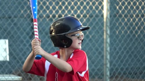 Boys practice for a little league baseball game.