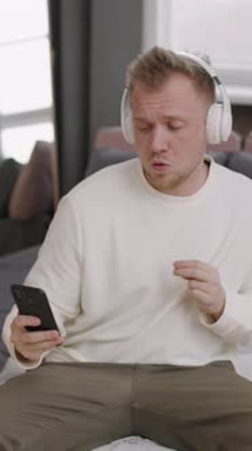 Man Listens to Music and Dances at Home