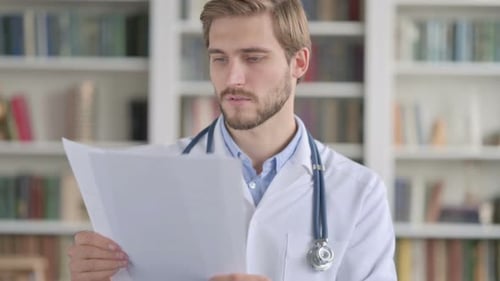 Doctor Reading Documents in Clinic