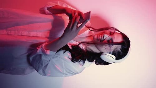 Trendy Woman Relaxing with Headphones and Phone