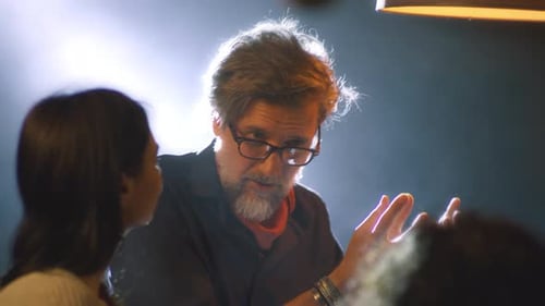 Man Discussing Business Ideas with Colleagues