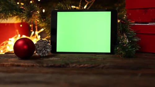 Christmas Background Red Gift Box Tablet Gadget Green Screen Wooden Table Lights