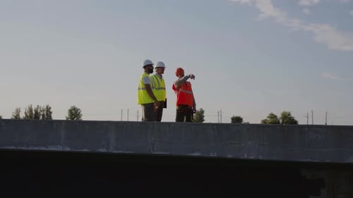 Contractors Talking on Unfinished Bridge