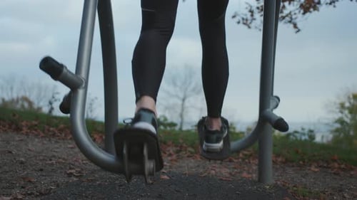 Legs and Feet Working Out on an Exercise Machine