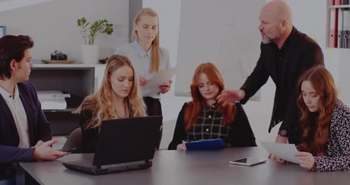 Businesswoman Giving Documents to Colleagues