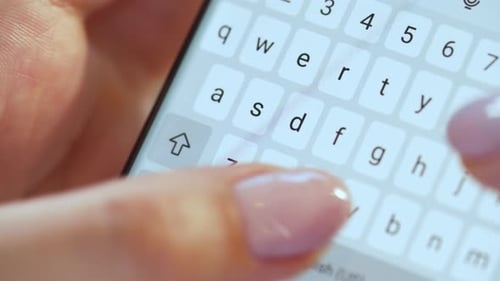 Hands Typing Text on Smartphone Close-up