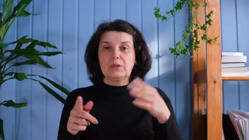 Woman Talking Indoors During the Daytime