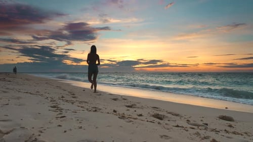 Asia Sunset Silhouette Woman Beach Sport Girl Run at Ocean Shore of Boracay Island Philippines