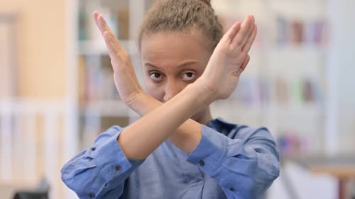 Woman Crossing Arms to Make an X Shape