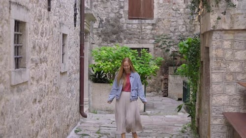 A Young Woman Visits the Old Town of Kotor in Montenegro