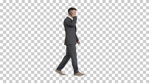 Businessman walking and talking on mobile phone, Alpha Channel