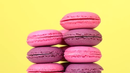 Stack of Pink and Purple Macarons on Yellow
