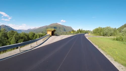 Driving a Car on a Road in Norway