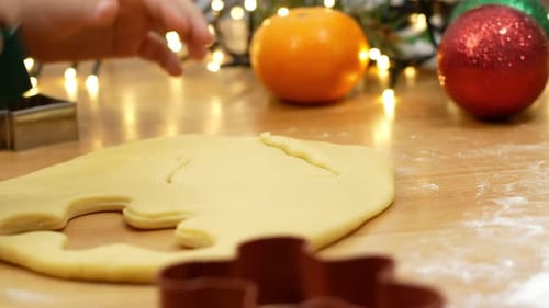 Child Making Christmas Cookies at Home