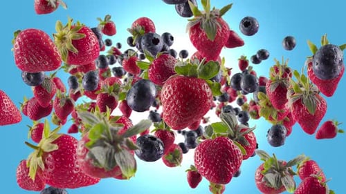 Fresh Strawberries and Blueberries Falling with Water Droplets