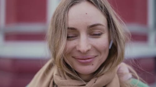 Smiling Woman Close-Up with Blonde Hair and Scarf