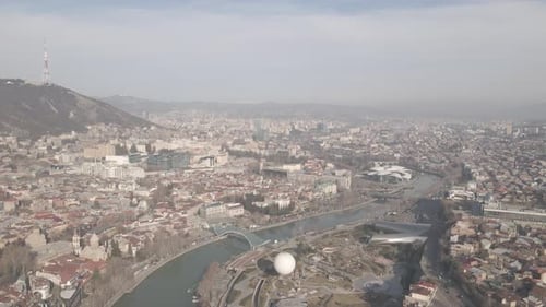 Aerial view of Metekhi church in old Tbilisi located on cliff near river Kura. Georgia 2021 winter