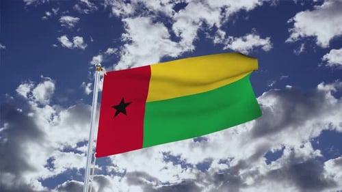 Guinea-Bissau Flag Waving Against Blue Sky With Clouds