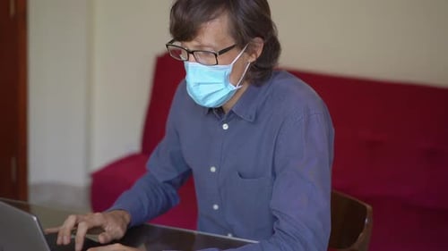 A Young Man Works From Home During Coronavirus Self-isolation. Slowmotion Shot