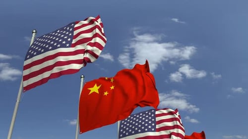 United States and China Flags Waving in Blue Sky