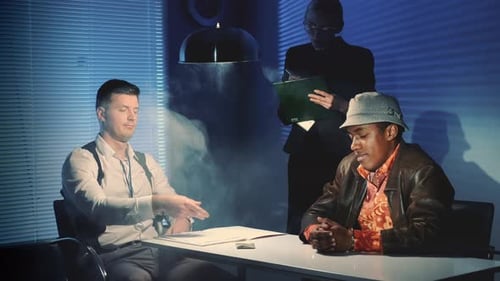 Dramatic Interrogation Scene With Two Men and Woman