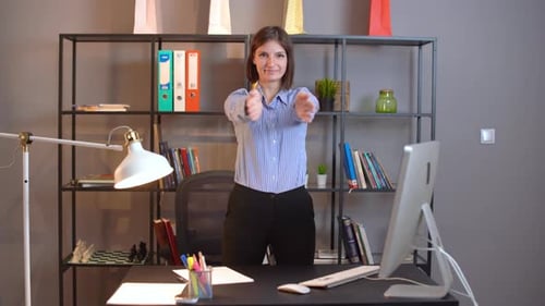 Woman Doing Stretching Exercise in Office