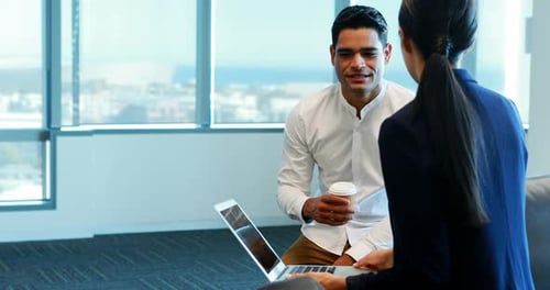 Collaborative Meeting with Laptop in Modern Office