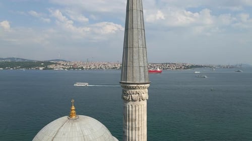 Slow rise above Dolmabache Mosque's dome and minaret