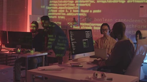 Programmers Working in Team at Night