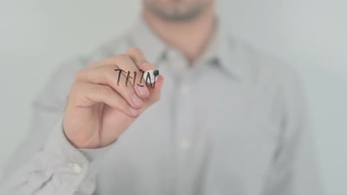 Hand Writing 'Thinking is Important' on Clear Surface