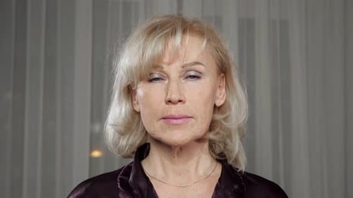 Woman Smiling in Silk Shirt Indoors