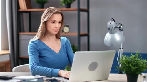 Confident Business Woman Working Use Laptop Typing Online Document Application at Home Office