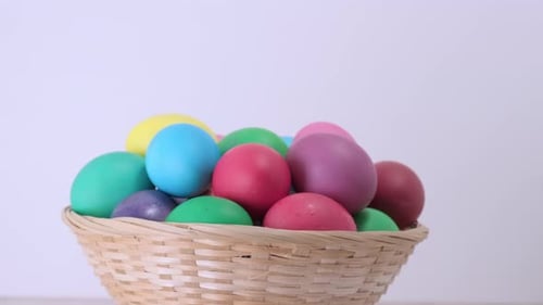 Colorful Easter Eggs in a Woven Basket