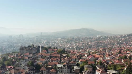 Drone Flying Over the Old Quarter of the City with Houses with Red Roofs