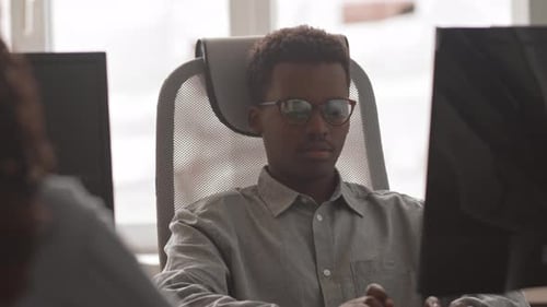 IT Specialists Working in Office