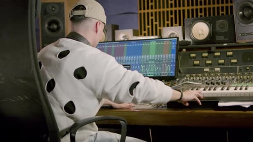 Young Caucasian Man Working at Music Recording Studio