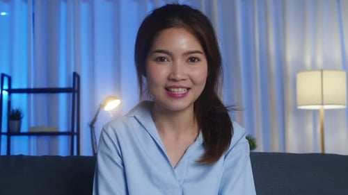 Smiling Woman Talking on Video Chat at Home