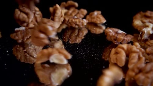 Shelled Walnuts Falling in Slow Motion
