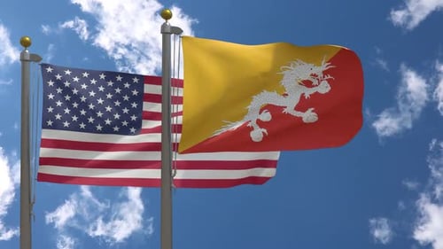 United States and Bhutan Flags Waving Together on Flagpoles