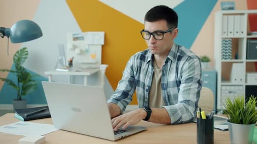 Office Employee Working with Computer Then Turning Off Laptop Finishing Work