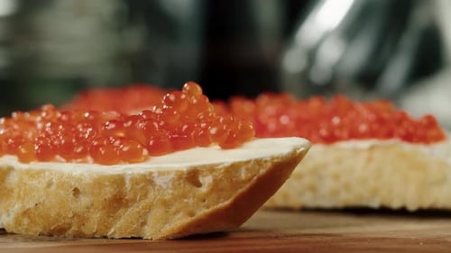 Chef Prepares Caviar Canapes with Golden Fork