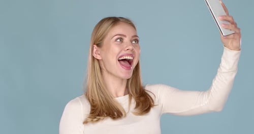 Blonde Woman Posing for Smartphone Selfie